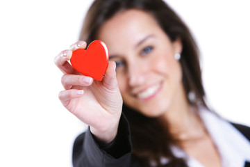 Young woman shows a red heart