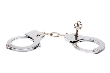 A pair of handcuffs isolated over white