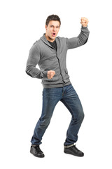 Naklejka premium Full length portrait of a male gesturing happiness