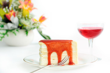 Strawberry crepe cake on white background