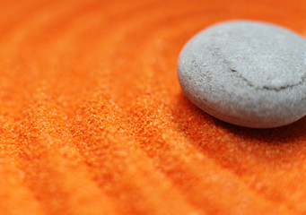 Fototapety  galet sur sable de couleur orange