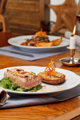 Obraz na płótnie Canvas Fried tuna steak and potatoes on the plate