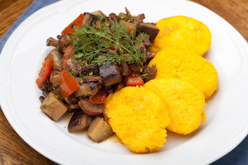 Polenta slices with vegetable stew