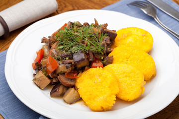 Polenta slices with vegetable stew