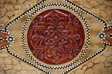 wood background with carving and painting