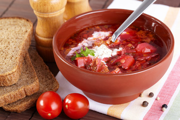 Russian cuisine. Borscht on the served table
