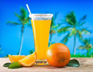 orange juice in a glass on a table