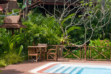 Swimming pool in garden, Thailand