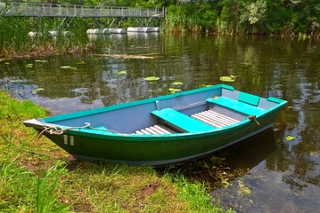 small elegant boat on a summer river