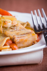Fish, cherry tomatoes and potatoes. Pesce, pomodorini e patate.