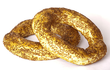 The Turkish bagel strewed by sesame seeds on white background
