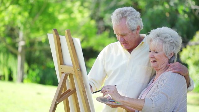 Retired couple painting together