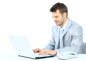 Portrait of young confident business man with laptop
