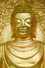 Fototapeta na wymiar Golden statue of the Buddha