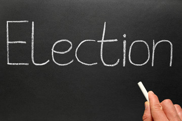 Election, written with white chalk on a blackboard.