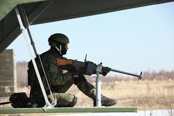Fototapeta premium Side view of man sitting in helicopter while patrolling