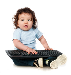 little kid with a computer keyboard