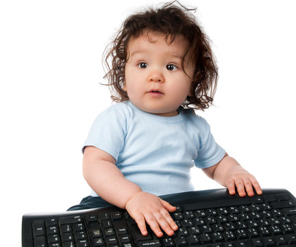 little kid with a computer keyboard