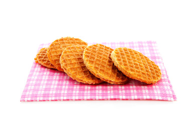 Pile of typical Dutch stroopwafels ( with syrup) on napkin