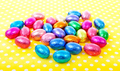 Colorful easter eggs on yellow dotted napkin