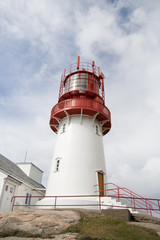 Fototapeta na wymiar Red and white lighthouse