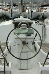 Fotobehang sailing yacht cockpit and steering wheel © William Richardson