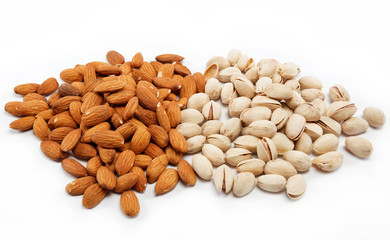 Almond and pistachio nuts on the white.