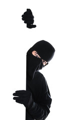 Robber hiding under a wall
