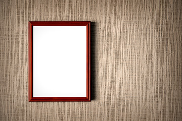 Old wooden photo frame on wall background