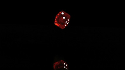 One red translucent dice in a super slow motion falling - Powered by Adobe