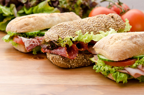 3 sandwiches with various healthy ingredients