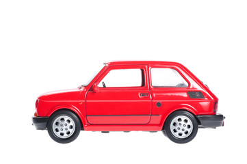 Small red car on white background. - obrazy, fototapety, plakaty