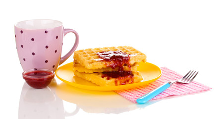 Tasty waffles with jam on plate isolated on white