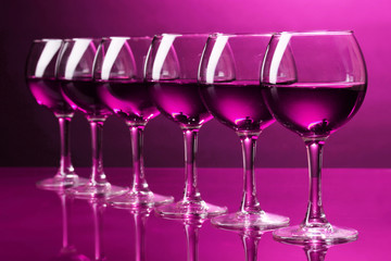 Wineglasses on pink background