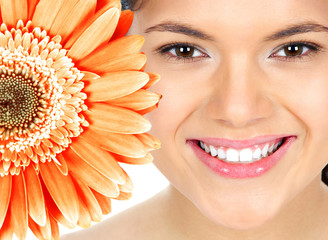 Beautiful woman smile with flower.
