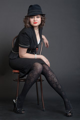 girl in black on a chair