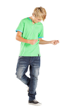 teen boy dancing with music isolated on white