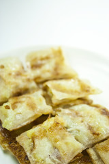 dessert style of fried roti with banana inside in Thailand