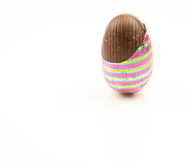 Chocolate easter egg partially unwrapped