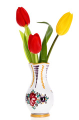 Spring flowers in vases isolated on white