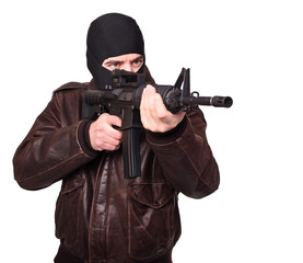 Caucasian terrorist with balaclava and assault rifle isolated white background