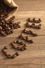 Grains of coffee on a wooden surface