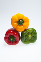 close up of red, yellow and green peppers