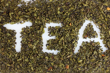 Word tea made of dry leaves closeup