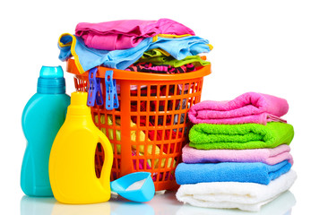 Clothes with detergent and washing powder in orange plastic