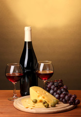 Bottle of great wine with wineglasses and cheese