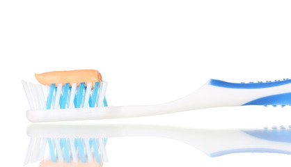Toothbrush with paste isolated on white