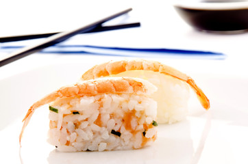 sushi and soy sauce in the background