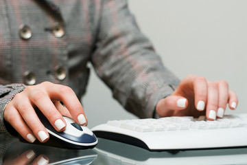 Female hands using computer