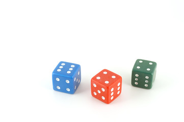 Three color dice over white